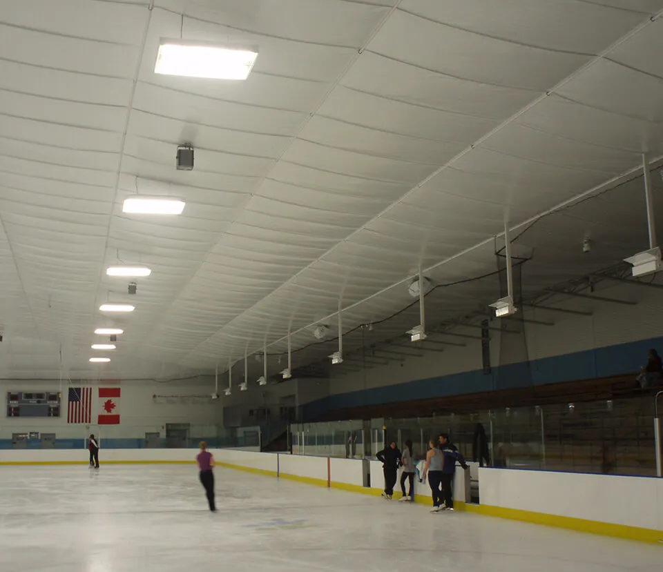 Insulated ceiling above an indoor ice arena