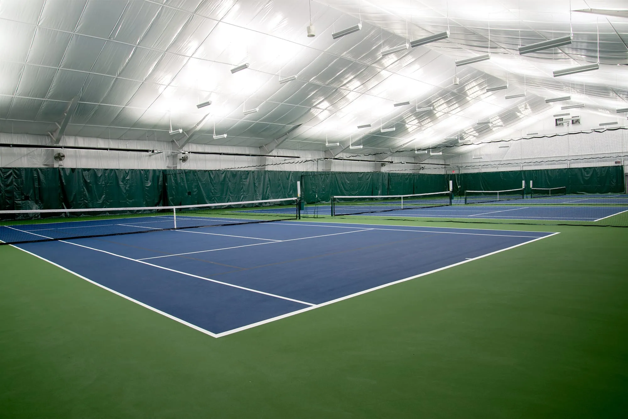 Insulated metal-building indoor tennis facility completed by The Northview Group
