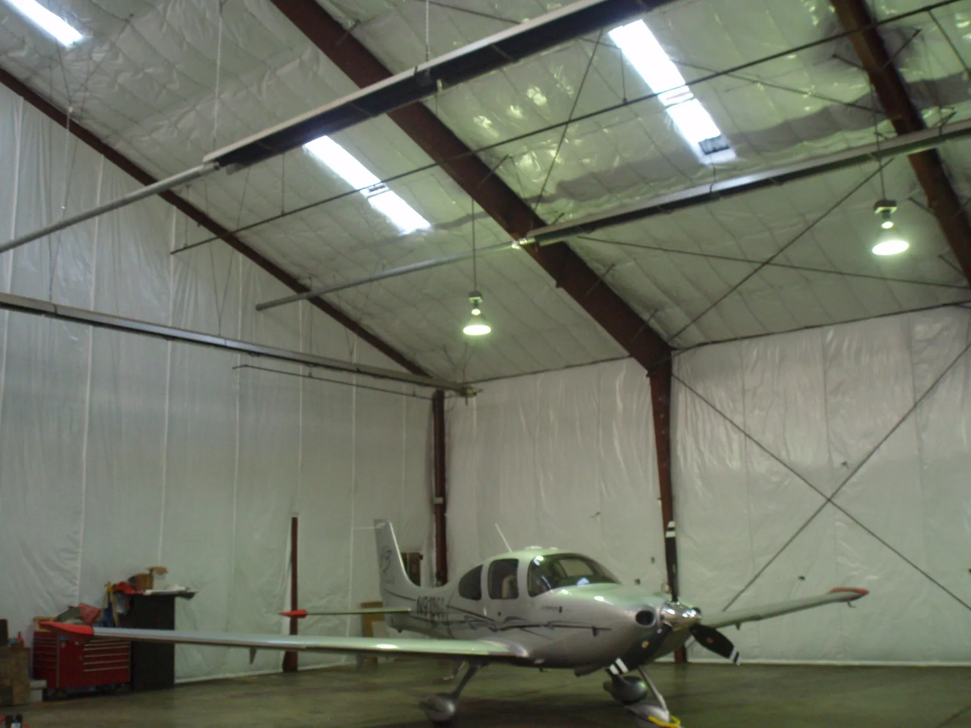 Private airplane hangar with insulated walls and ceiling